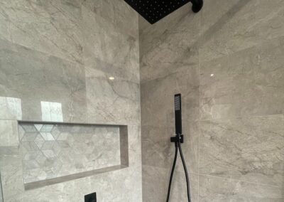 shower niche with geometric tiles